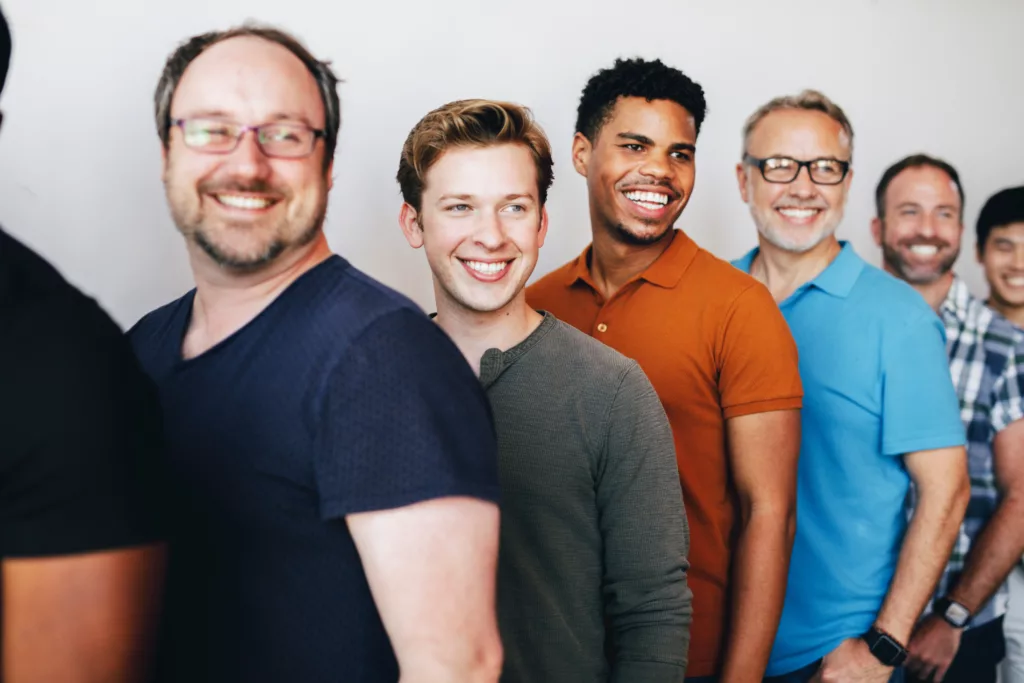 Happy men standing in a row - NinjaFitness
